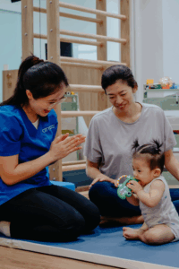 Physiotherapist with baby